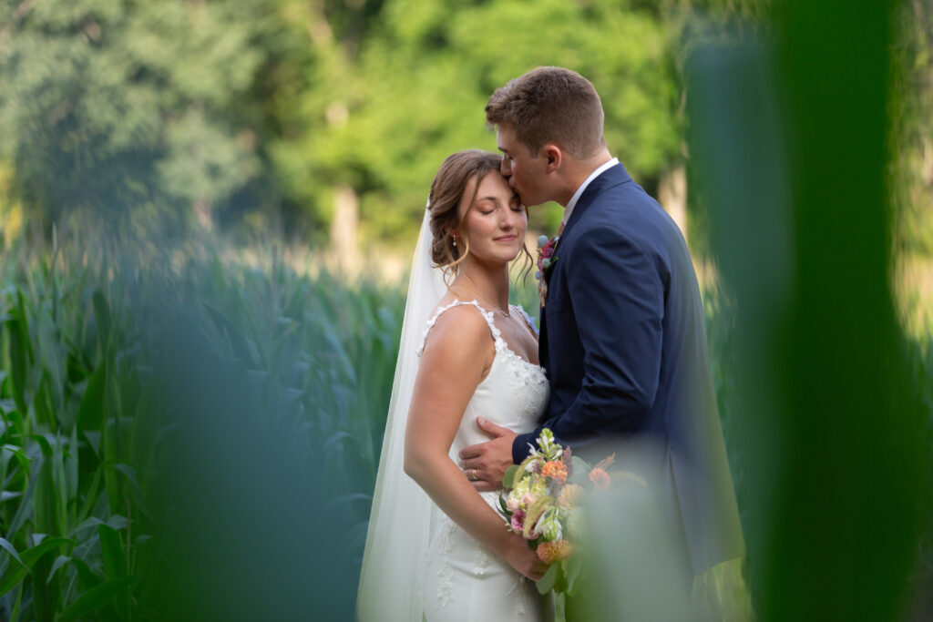 Mr. and Mrs. Zarchin bride and groom portraits north carolina. On the farm in the corn field in the summertime